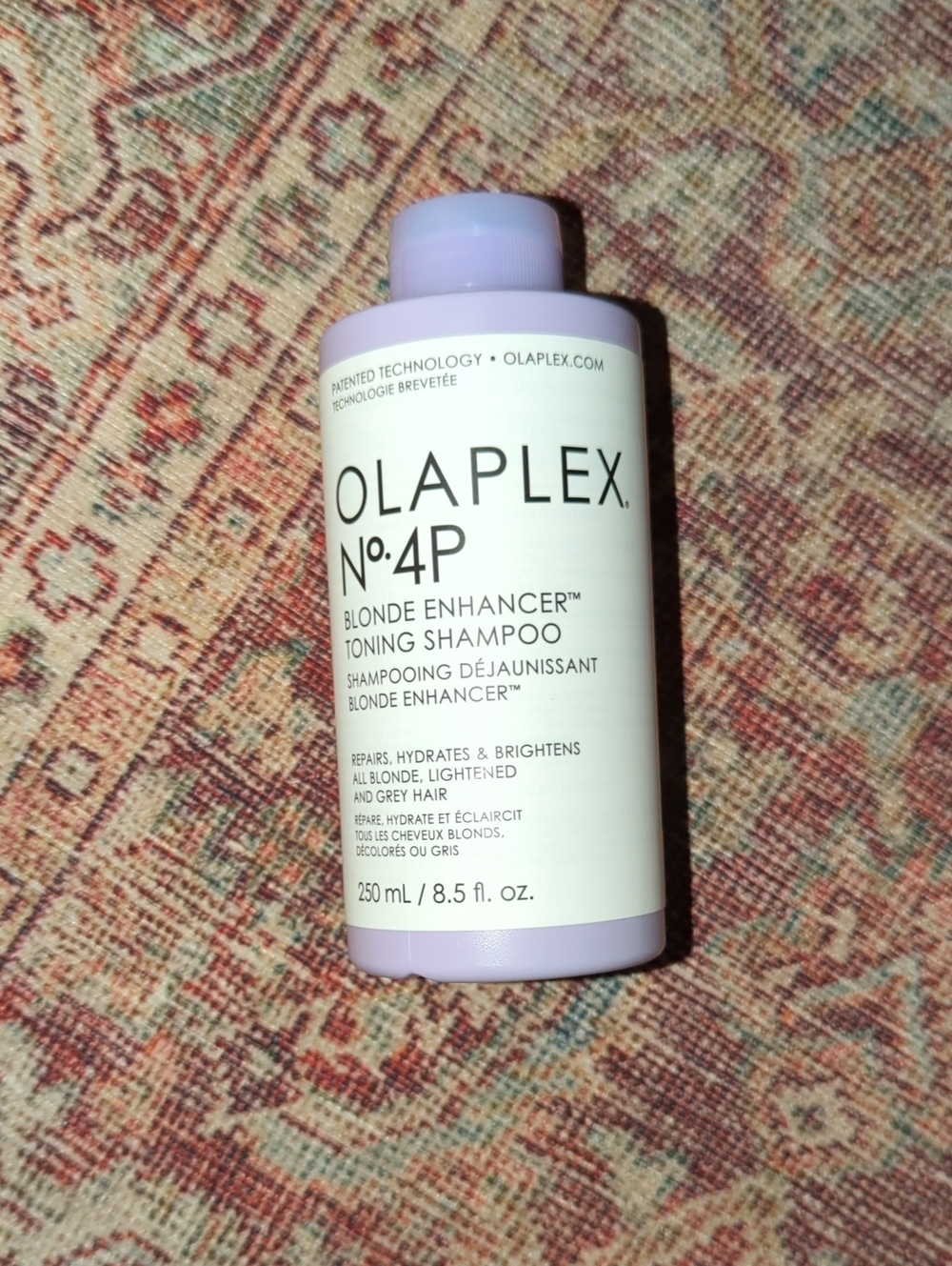 OLAPLEX No.4P Blonde Enhancer Toning Shampoo - Lavender and White
